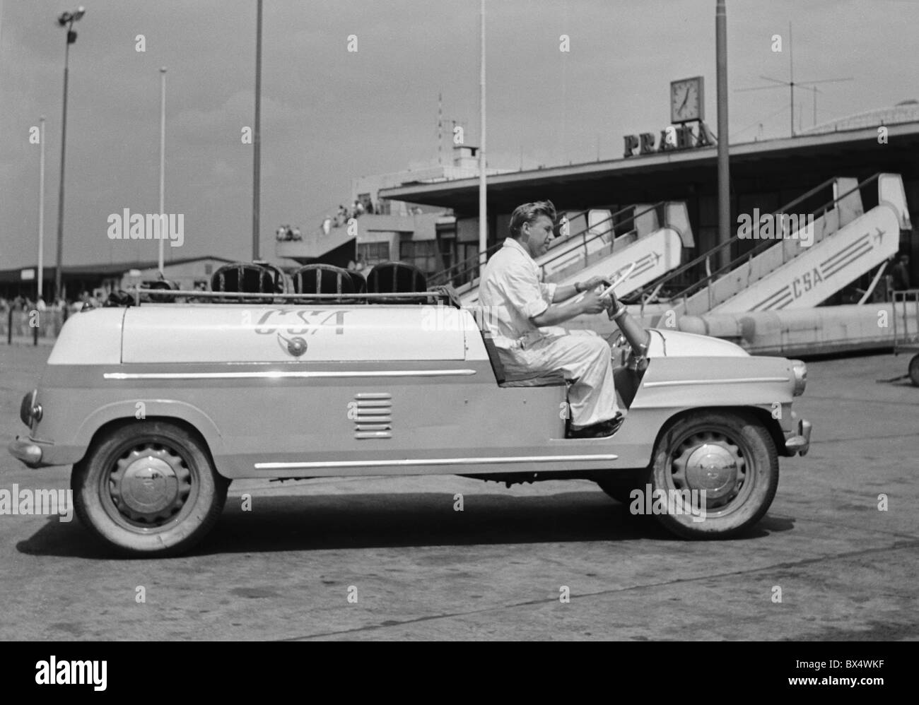 Airport vehicle used to pull luggage carts from aircraft to terminal