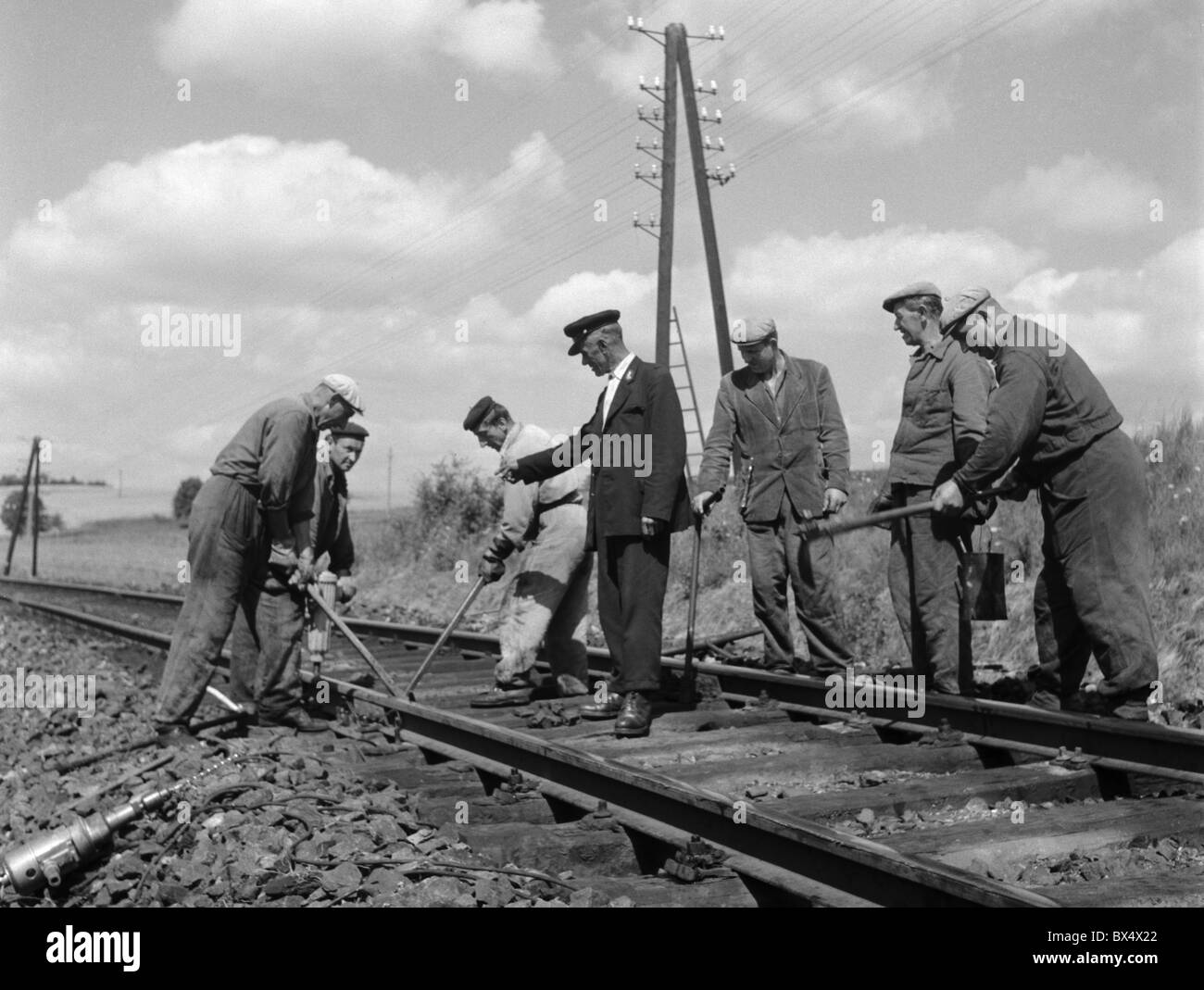 Railroad workers repair damaged track. Czechoslovakia 1963. (CTK Photo