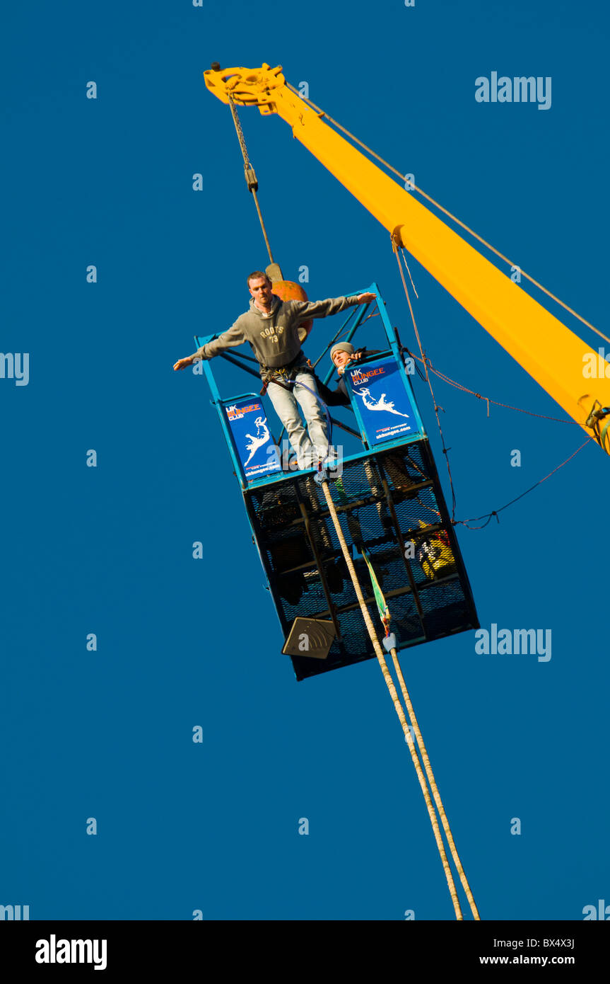 Bungee jumping from a crane, Salford Quays, Manchester, England, UK