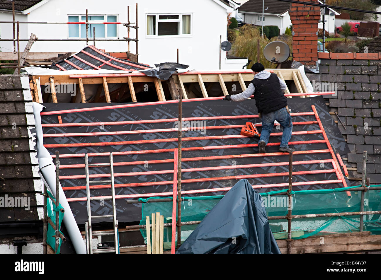 Renovating and reroofing a house extension Wales UK Stock Photo