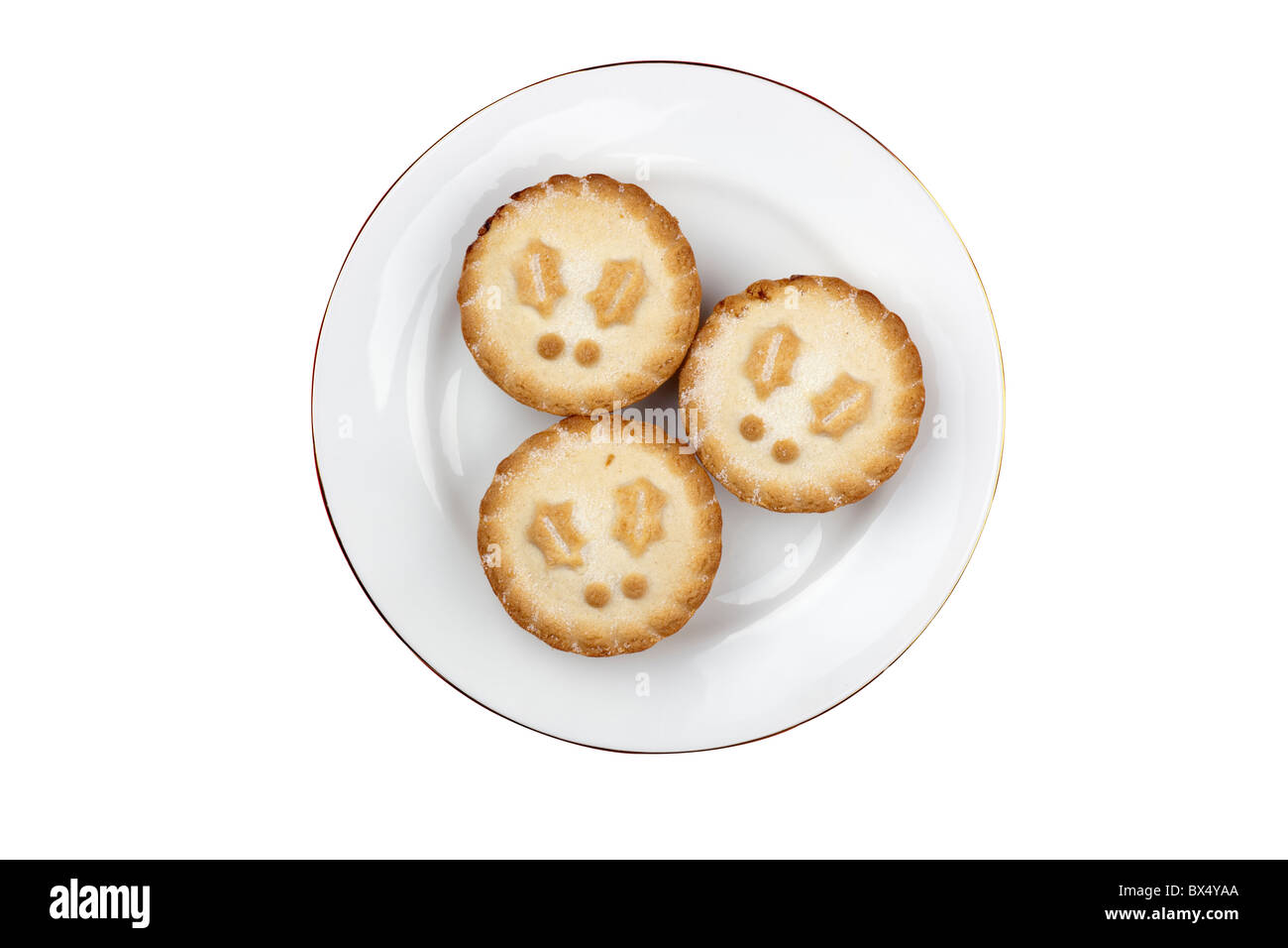 Three mince pies on a white plate Stock Photo
