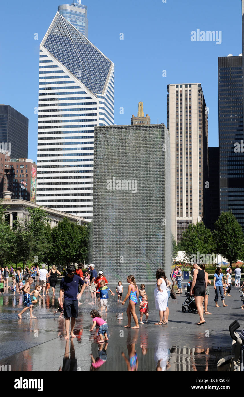 Downtown Chicago on a brilliant summer day, The Crown Fountain in Millenium Park, upper left, The Stone-Smurfit Building. Stock Photo