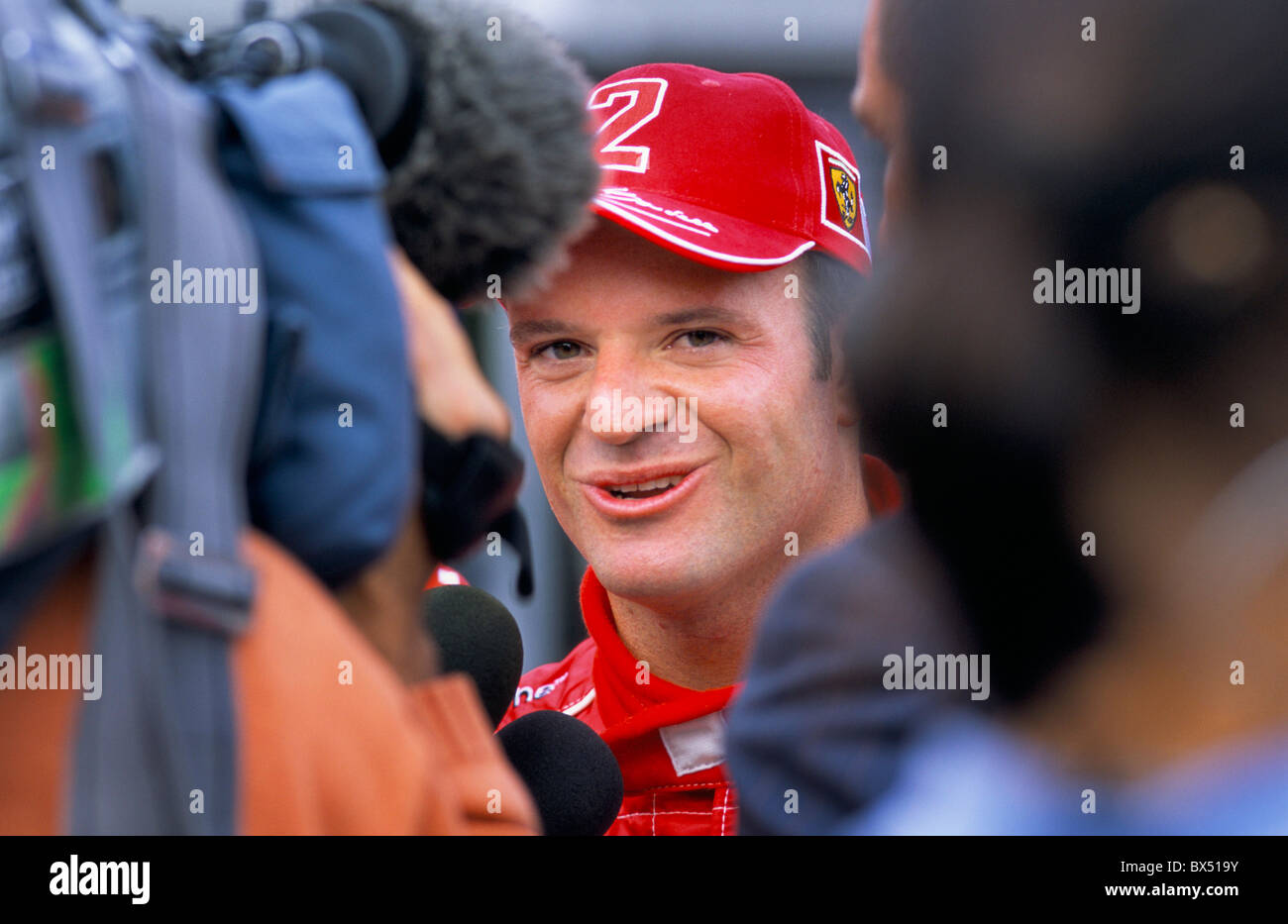 Formula 1 driver Rubens Barrichello giving an interview after winning the 2003 British Grand Prix. Stock Photo