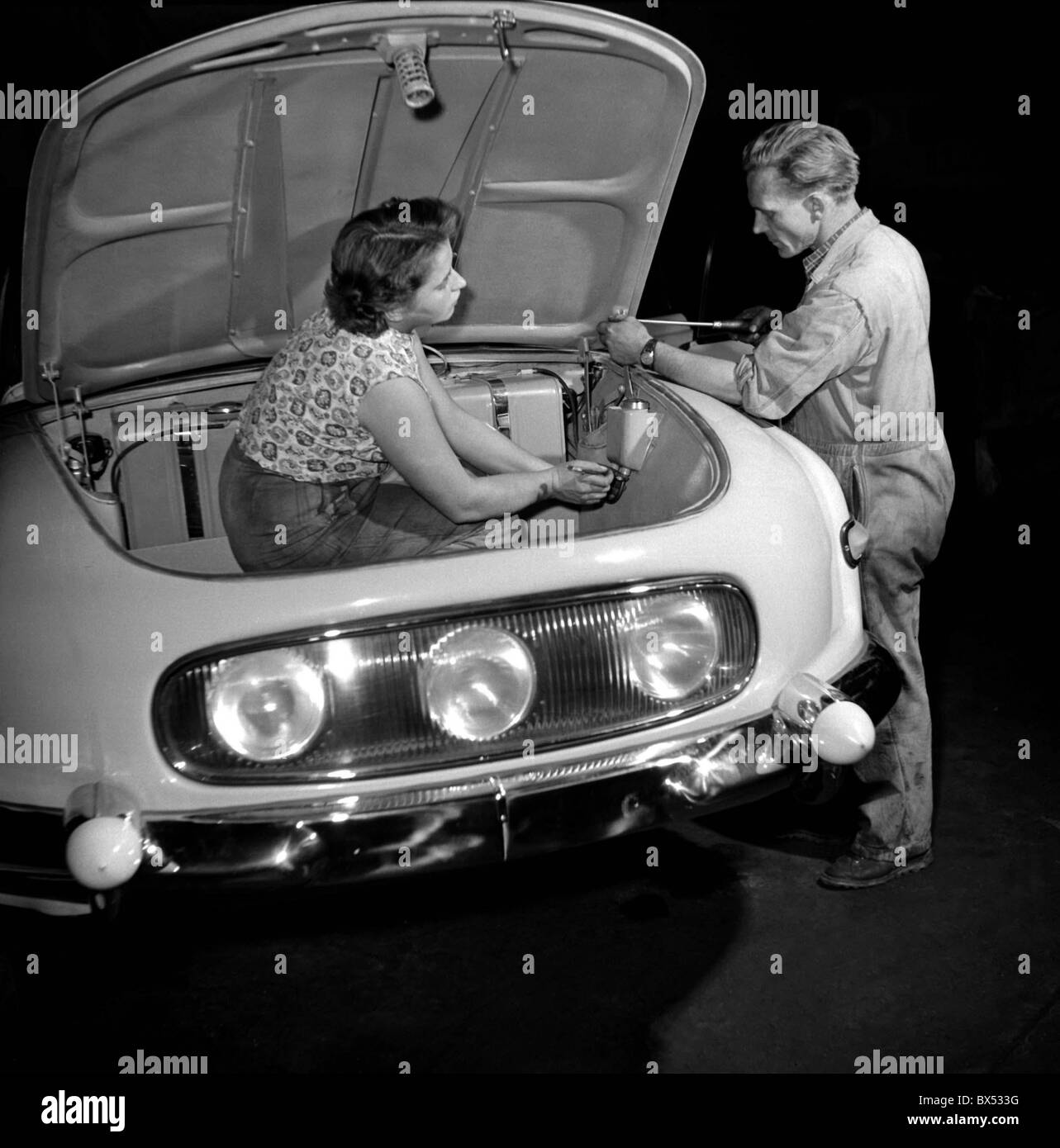 Oldrich Bittner right and Marie Horakova left are giving last touches to Tatra 603 in the Tatra assembly facility in Koprivnice Stock Photo
