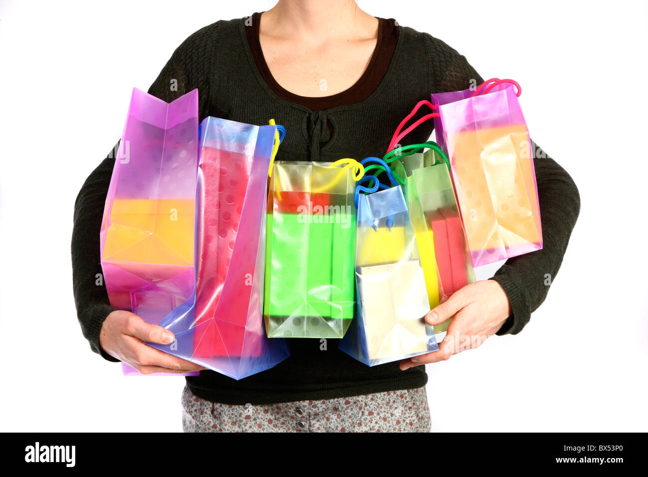 Young woman carrying gift boxes, cardboard boxes, of different sizes