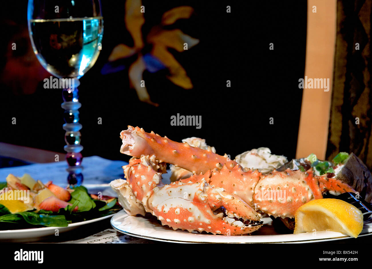 Delicious Alaskan King Crab dinner with a strawberry/spinach salad and a baked potato Stock