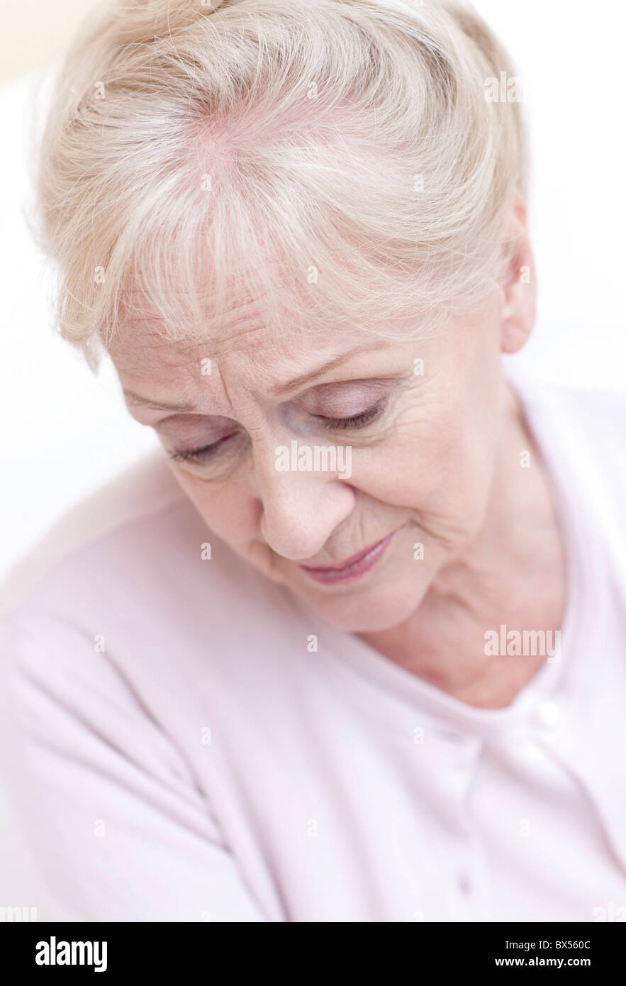 Depressed senior woman Stock Photo