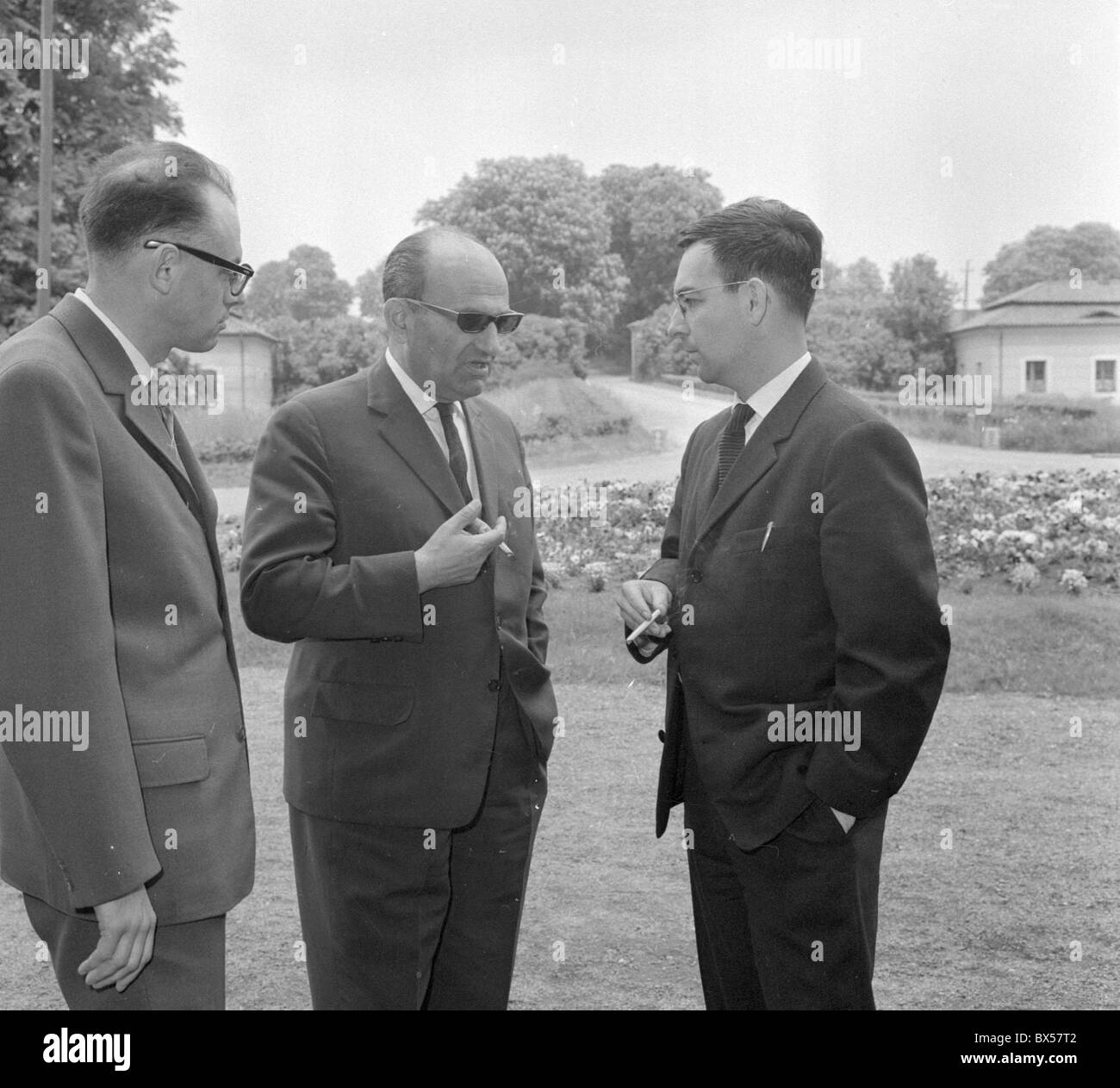 Czechoslovak Frantisek Kaufmann left Roman Karst of Poland center and Czechoslovak author Alexej Kusaak discuss during the Stock Photo