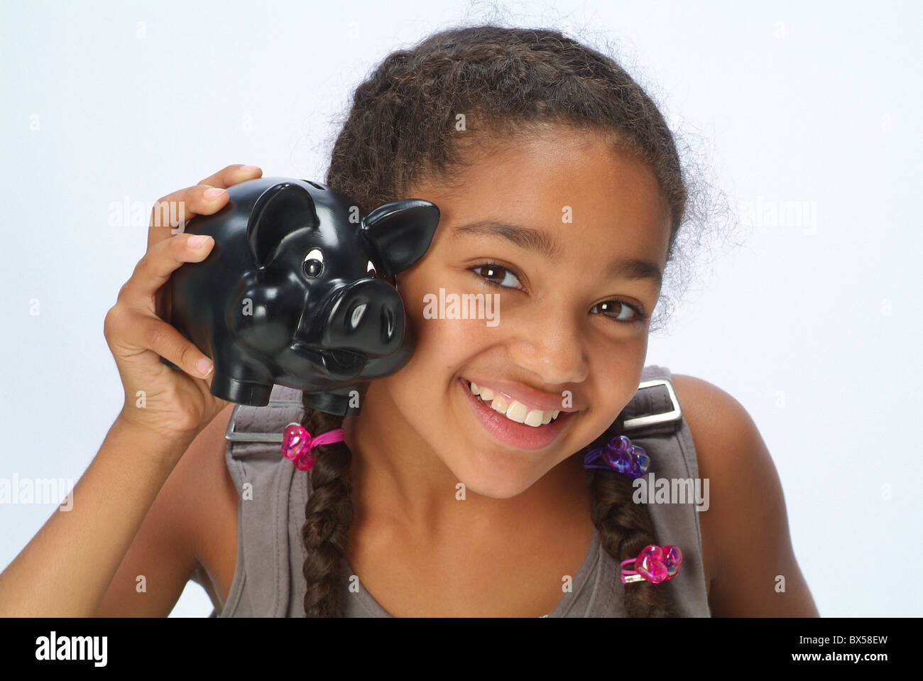 A girl with a piggy bank Stock Photo - Alamy