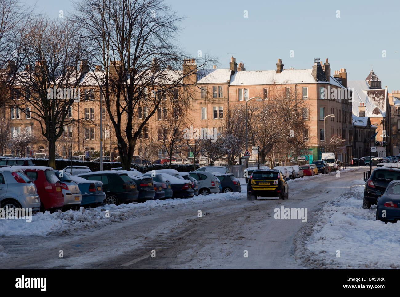 A learner driver on a snowy icy street, Dalmeny St Edinburgh Scotland Stock Photo