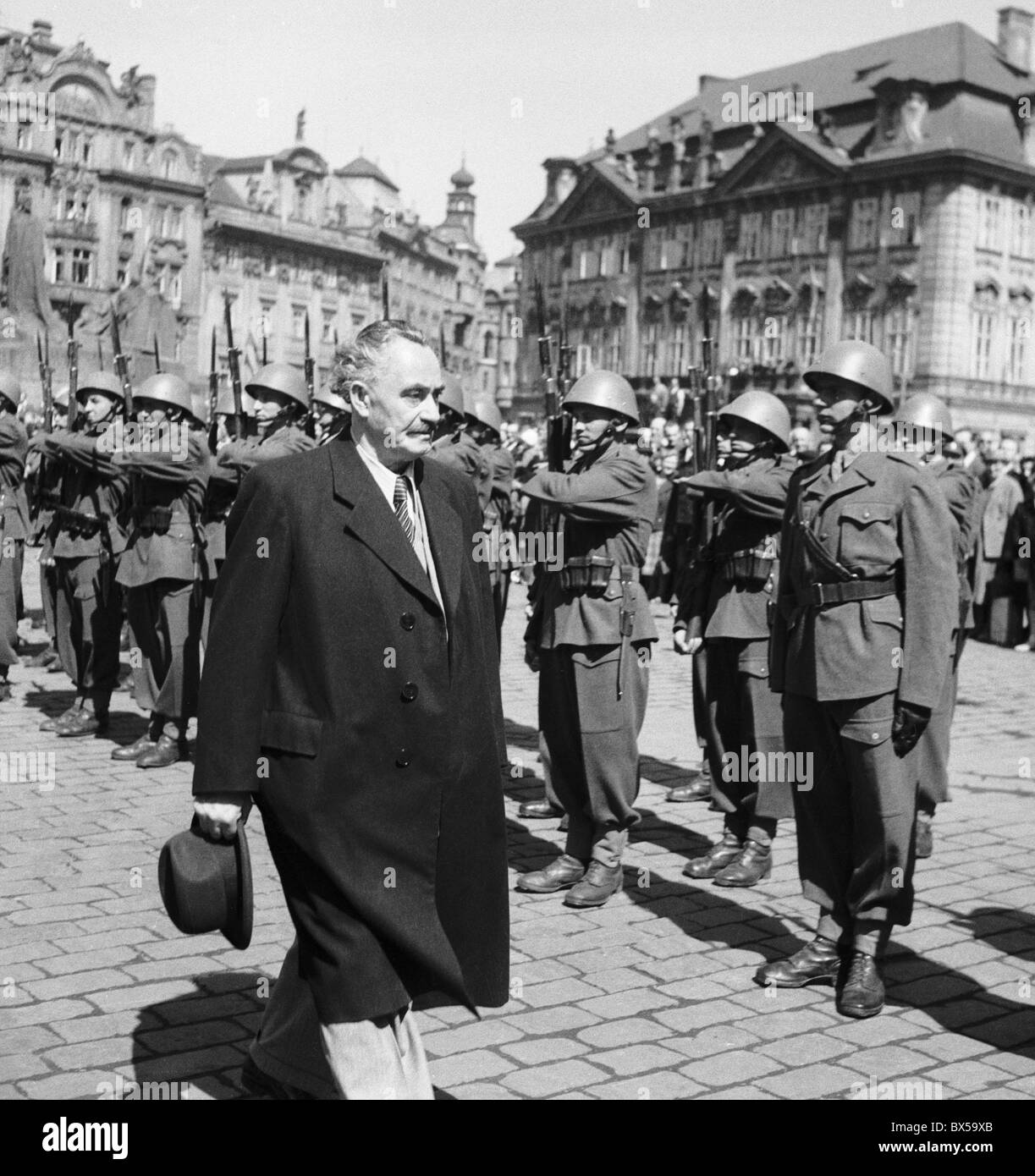 Czechoslovakia - Prague 1948. Bulgarian Communist and Prime Minister of Bulgaria Georgi Michailovich Dimitrov walks past army Stock Photo
