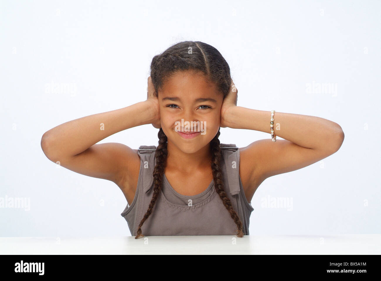 Portrait of a girl covering her ears Stock Photo Alamy