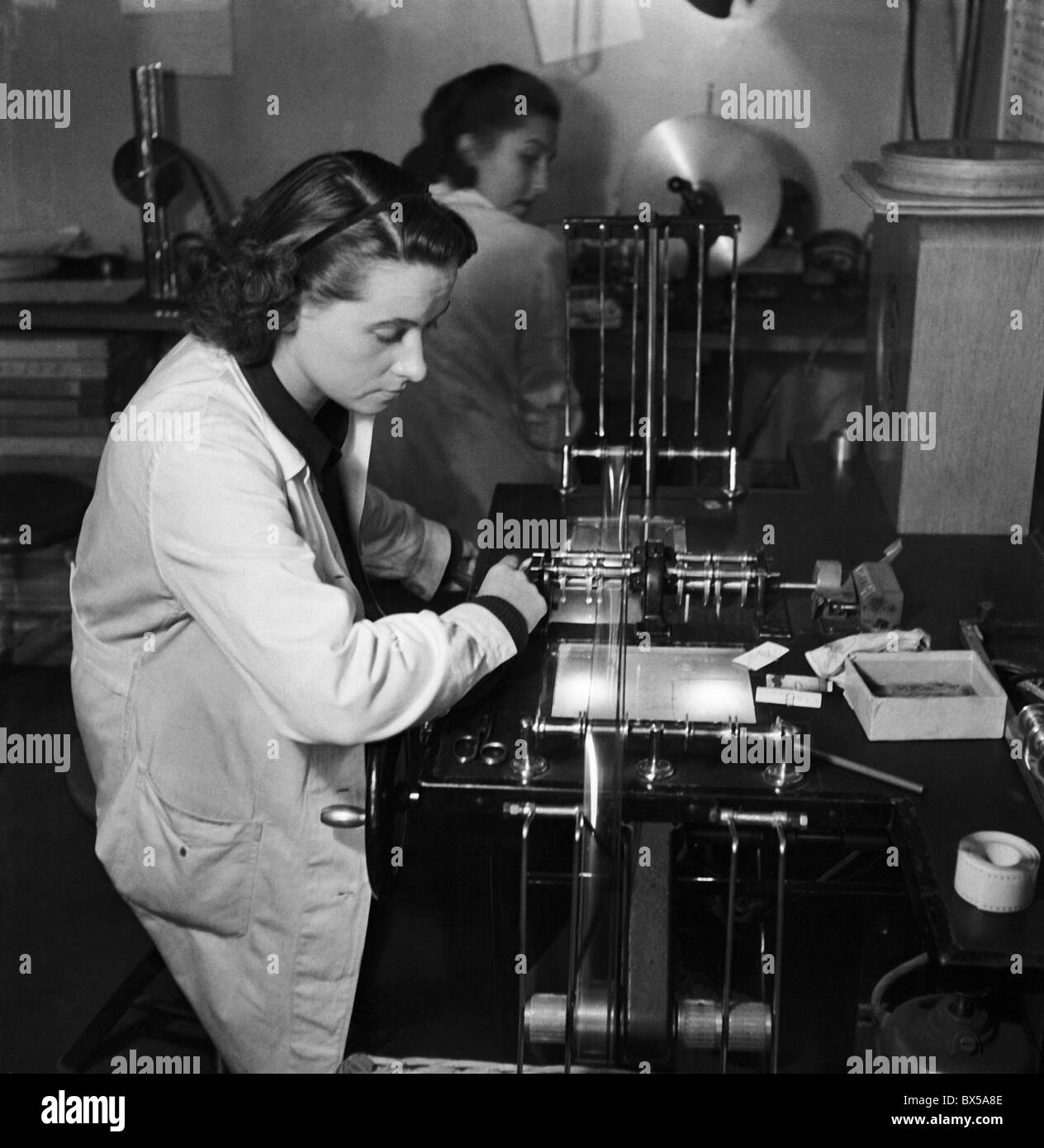Czechoslovakia 1947. Animated film employees edit films on editing machines in film studio. CTK Vintage Photo Stock Photo