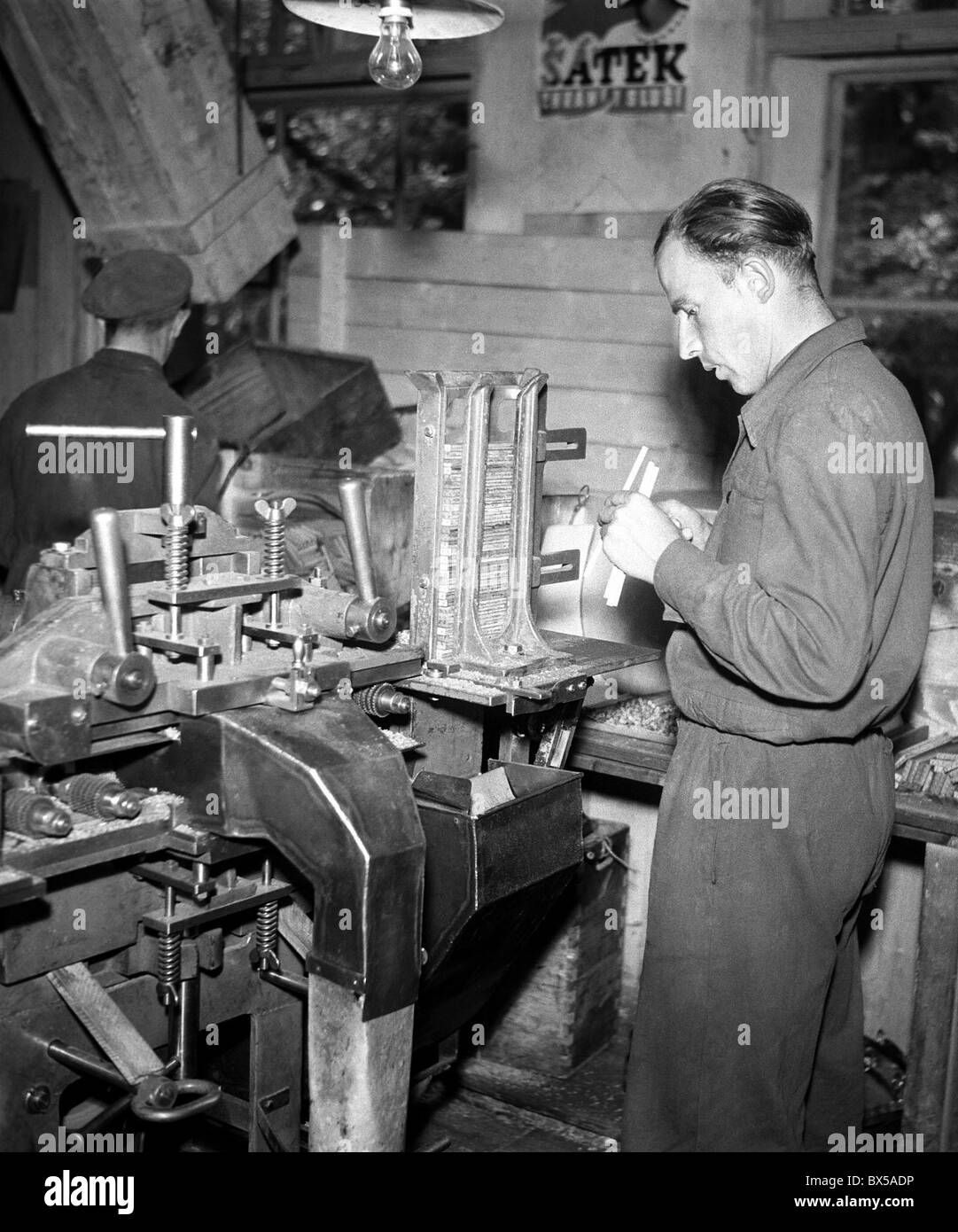 Czechoslovakia - Budweiss 1948.  Worker in  Koh-i-noor / Hardmuth pencil factory. CTK Vintage Photo Stock Photo