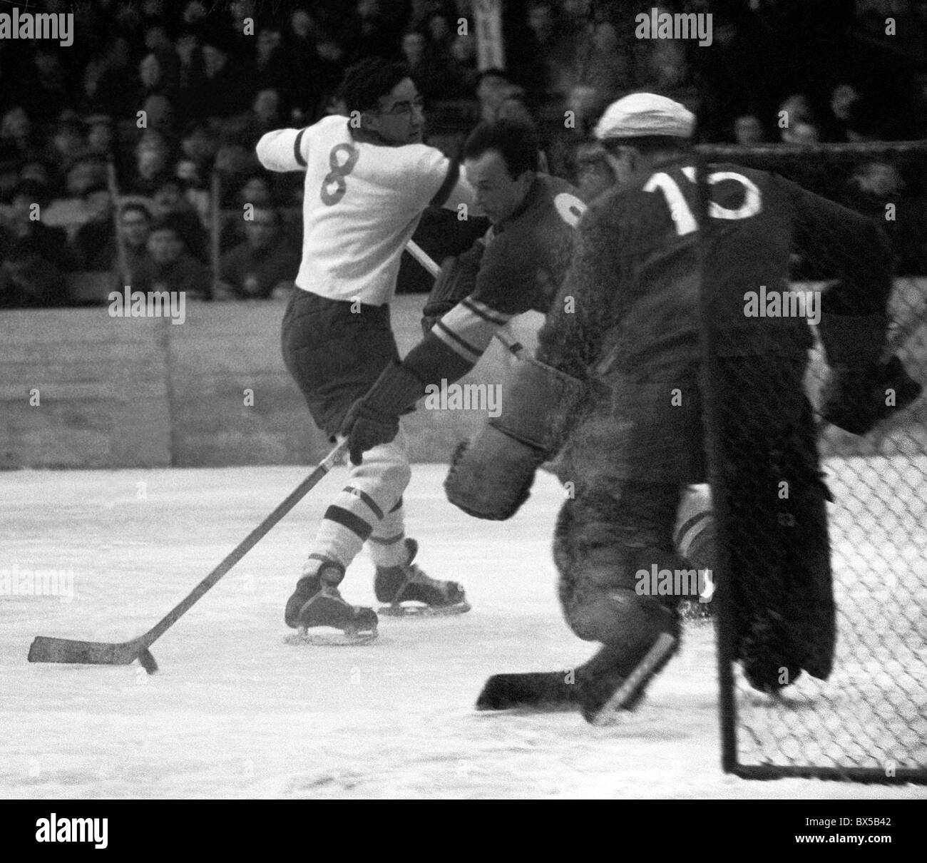 Action from Group B play at the 1961 World Ice Hockey championship match  between Great Britain and Poland at the Vernets rink, in Geneva,  Switzerland Stock Photo - Alamy