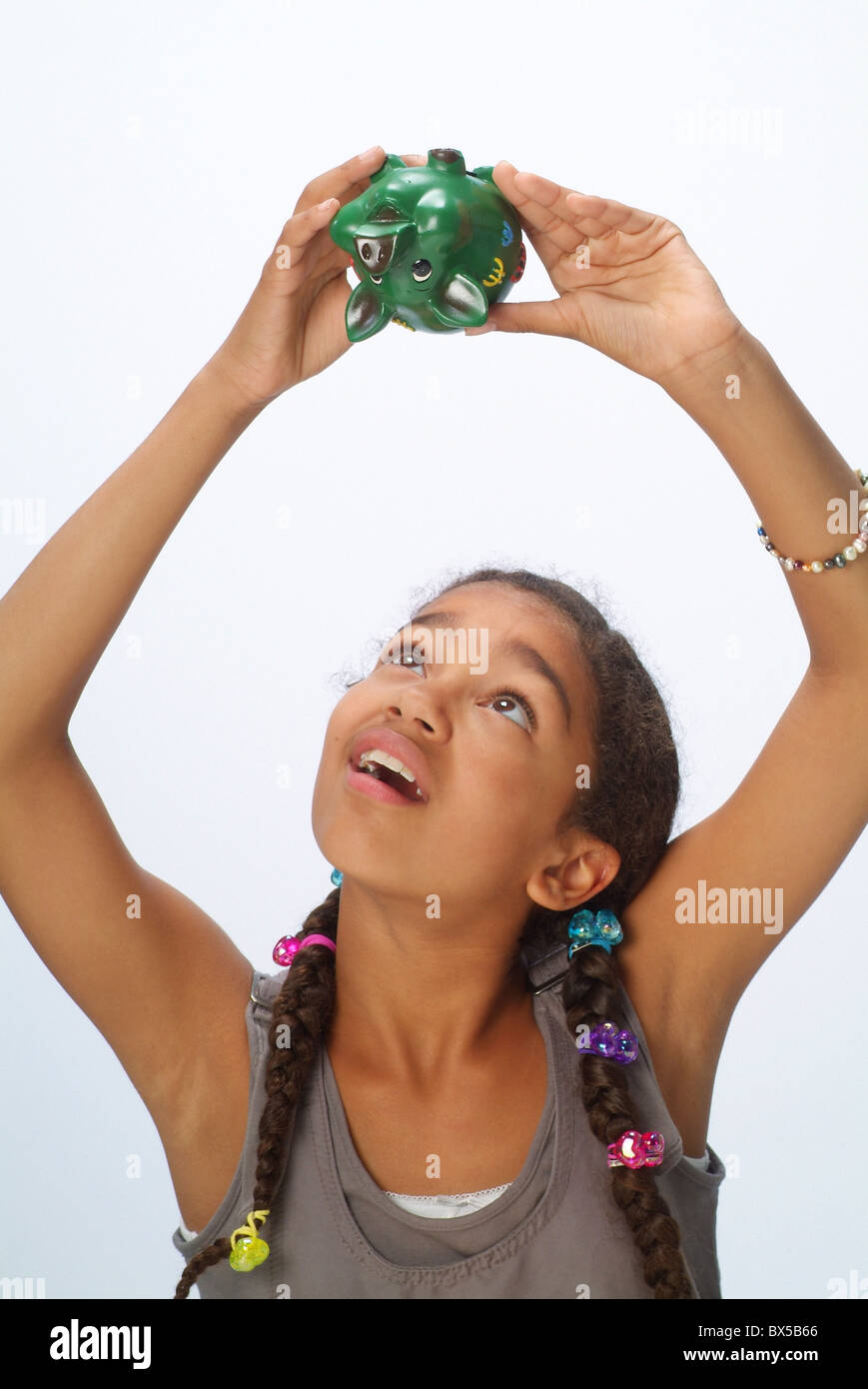 A girl with a piggy bank Stock Photo - Alamy
