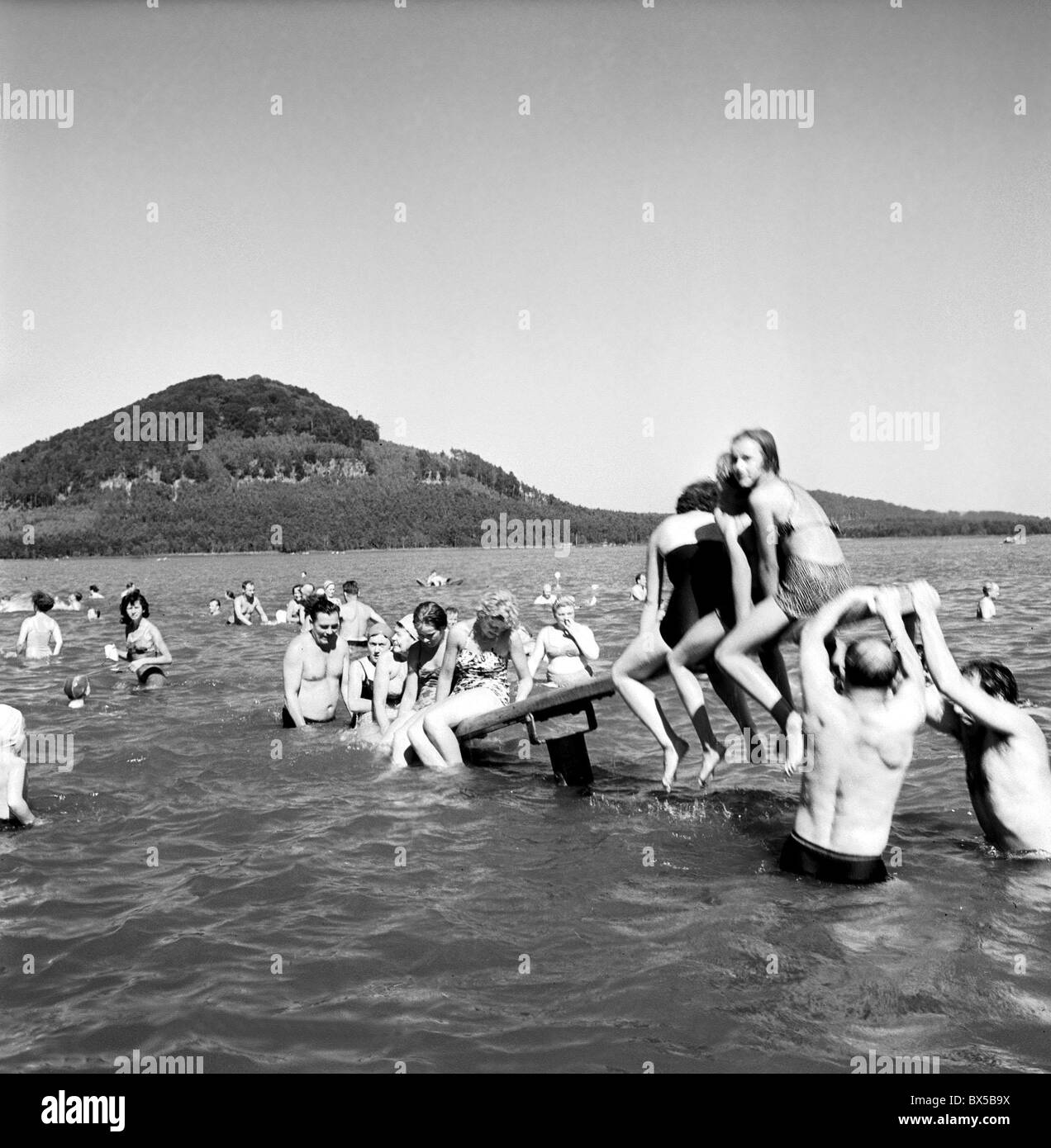Vacationers swim and sunbathe at Macha Lake, Stare Splavy, Czechoslovakia, 1959. (CTK Photo