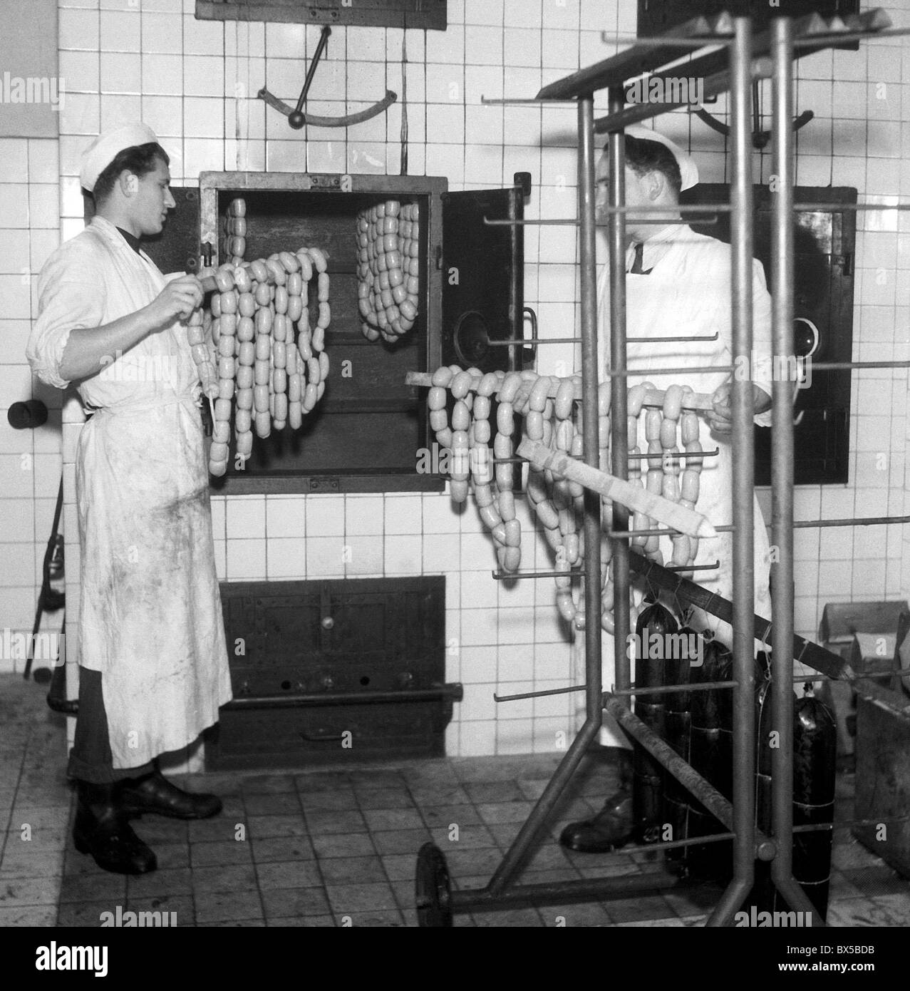 Prague 1946, butchers produce sausages in meat factory. Butcher school