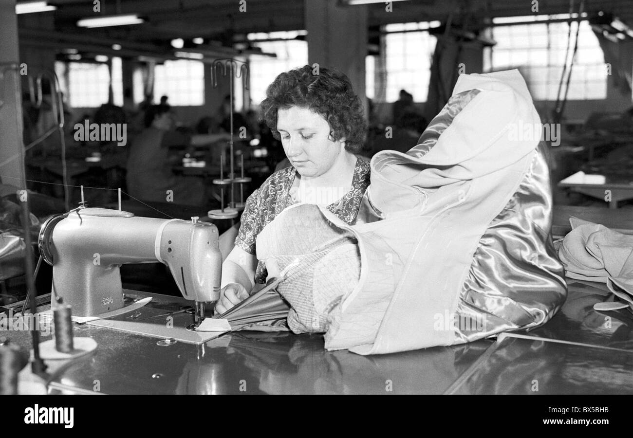 Female apparel worker sews coats in apparal plant in Prostejov, Czechoslovakia 1960. (CTK Photo / Jan Tachezy) Stock Photo