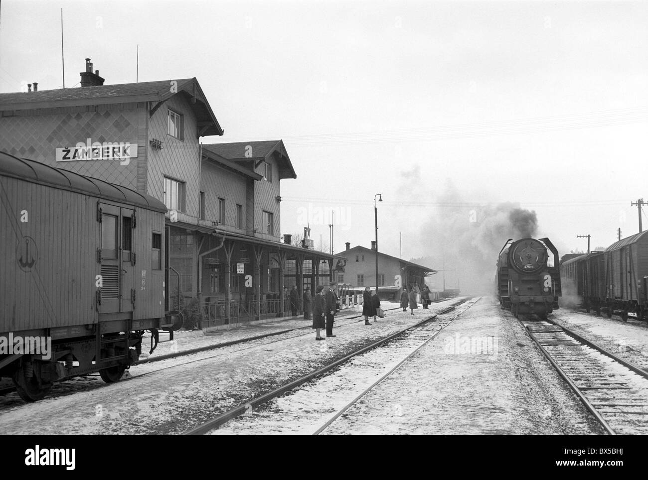 Snow covered train station with steam locomotive arriving in Zamberk, Czechoslovakia 1960. (CTK Photo / Bedrich Krejci) Stock Photo