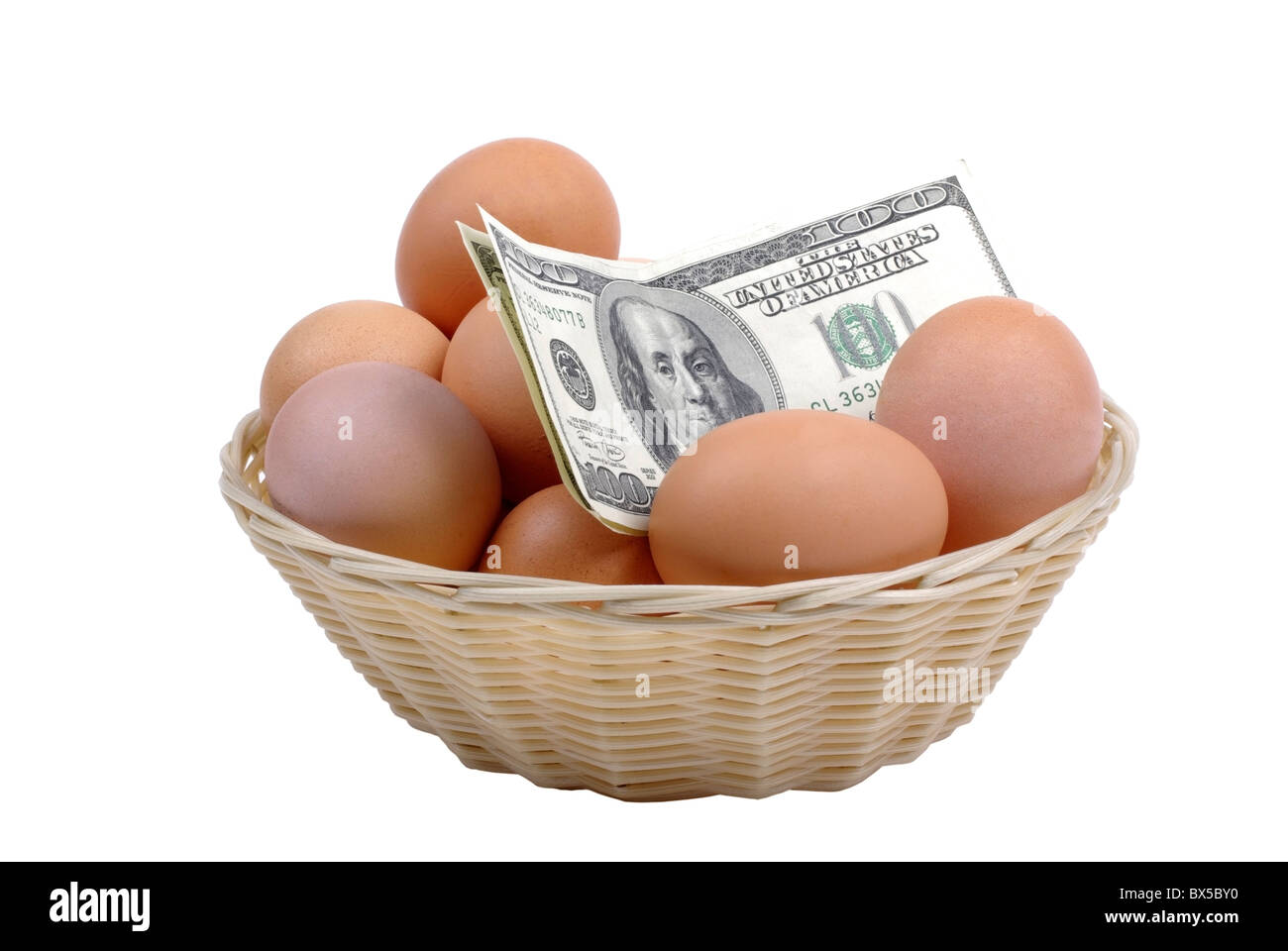 Eggs with dollars in basket isolated on white background. Financial concept. Stock Photo