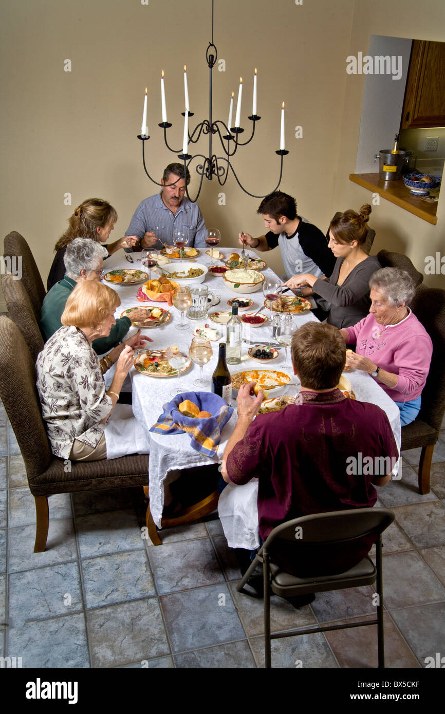 Three generations of a family gather for a traditional Thanksgiving turkey dinner in Southern California. Stock Photo