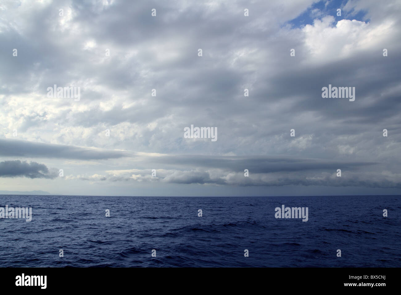 cloudy stormy day in the blue ocean sea seascape Stock Photo - Alamy