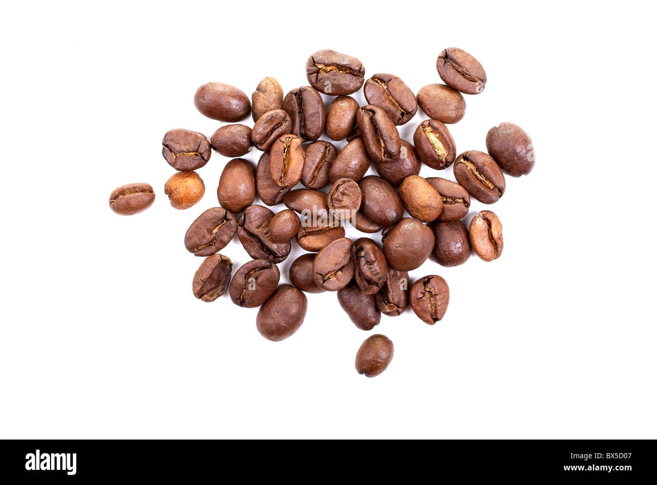 Heap of brown roasted coffee beans isolated on white background Stock ...