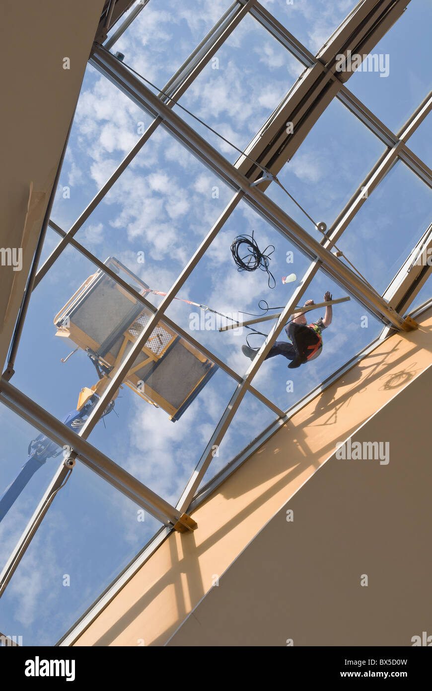 cleaning skylight windows on roof at bluewaters Stock Photo Alamy