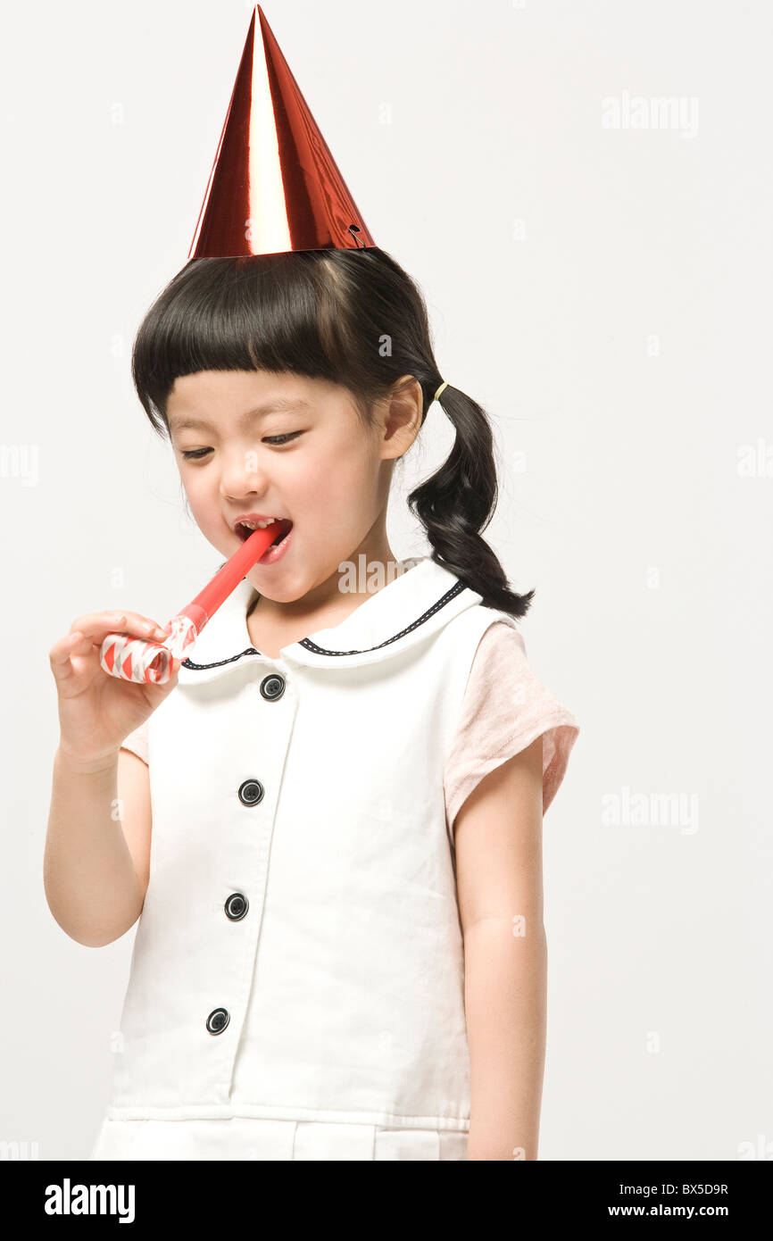Girl wearing party hat Stock Photo Alamy