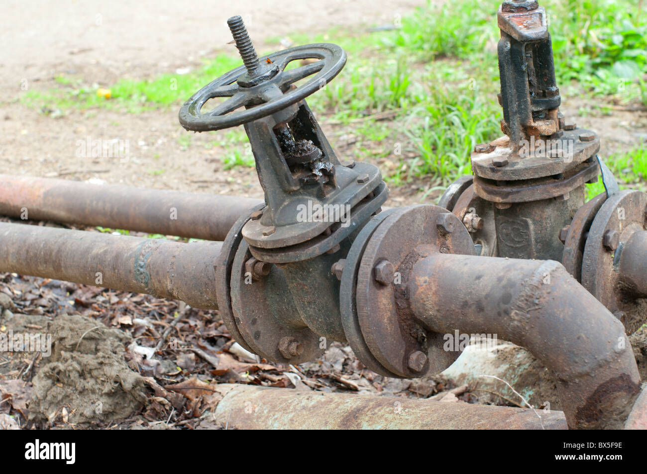 Pipeline cranes applied to giving of hot water in an apartment house Stock Photo