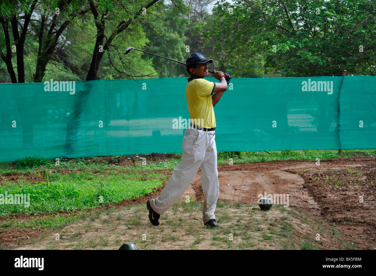 An Indian golfer teeing off Stock Photo - Alamy