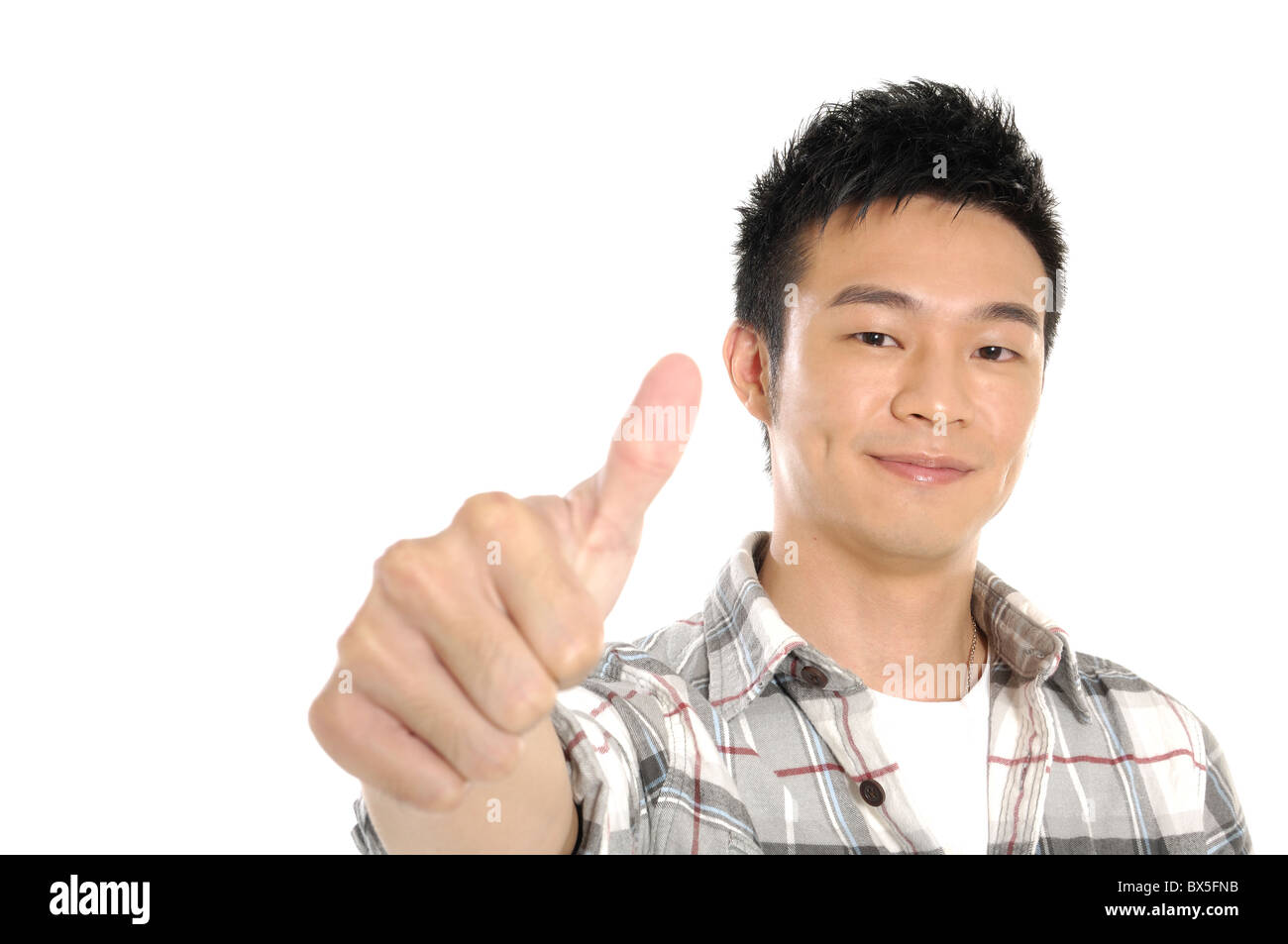Male university student showing thumbs up sign Stock Photo - Alamy