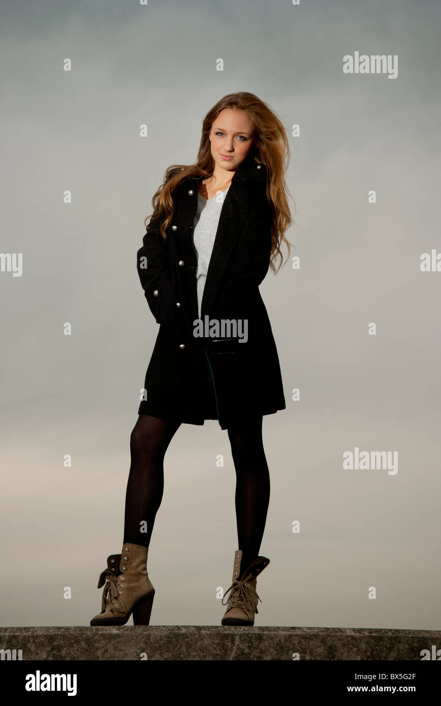 Woman black coat in hi-res stock photography and images - Alamy