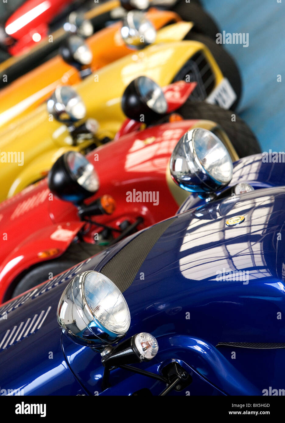 Caterham sports cars in different colours in showroom UK Stock Photo