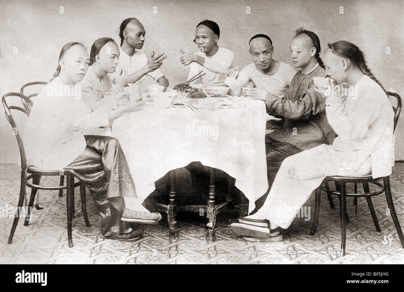 people, men, China, young men having lunch, circa 1900, chairs by Thonet, model No. 14, ethnicities, ethnic, ethnology, Chinese, chair, table, drinking, eating, dinner, hairstyle, hair style, chopsticks, historic, historical, Asia, Asian, Asians, 20th century, 1900s, Additional-Rights-Clearences-Not Available Stock Photo