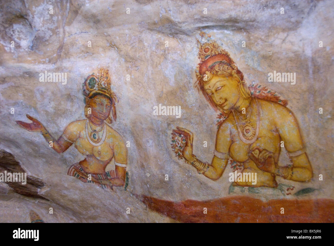 Buddhist frescoes in cave gallery part way up Lion Rock, Sigiriya, UNESCO World Heritage Site, Sri Lanka, Asia Stock Photo