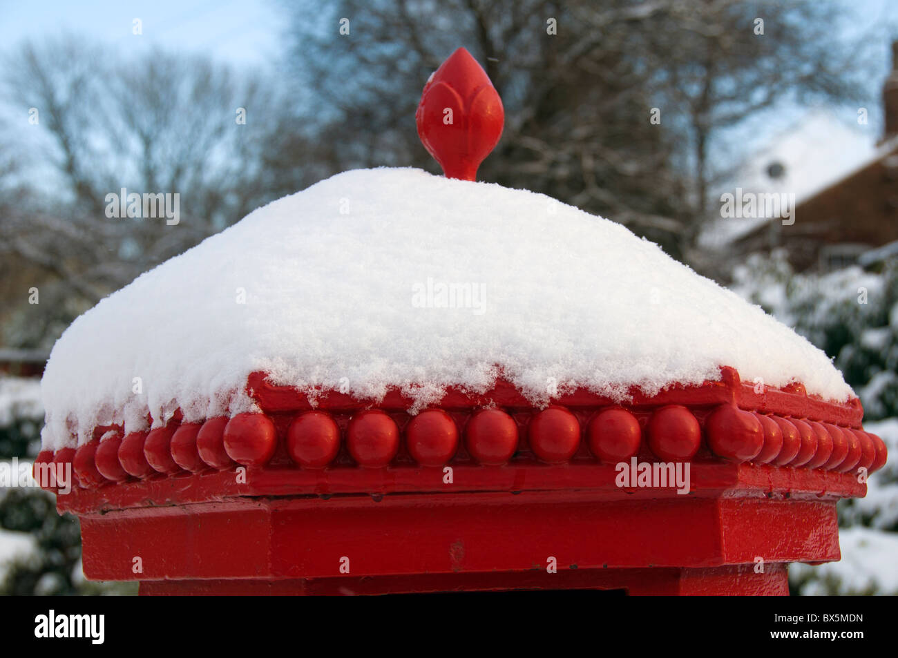 Victorian post box covered in snow at the Fairfield Moravian Settlement, Droylsden, Tameside, Manchester, England, UK Stock Photo