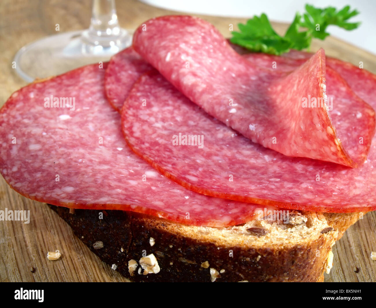 French salami with wine glass and herbs Stock Photo Alamy