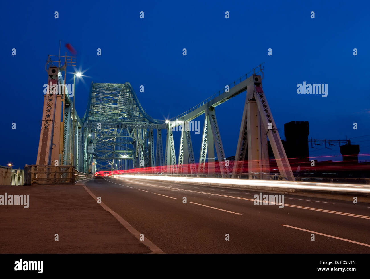 Runcorn Bridge at night with vehicle light trails Stock Photo