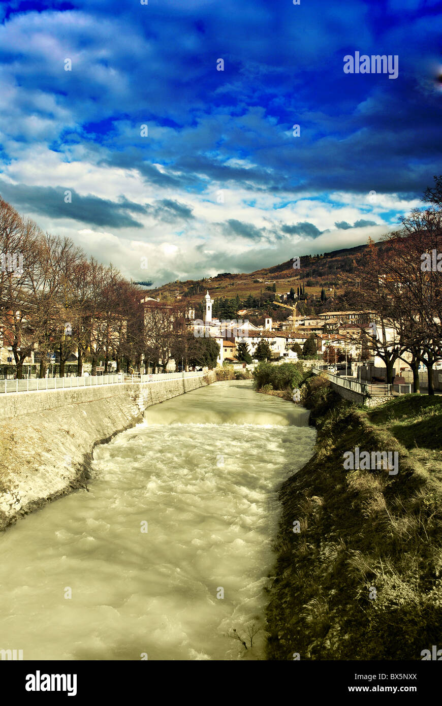 River with views of the city and the mountains in autumn Stock Photo ...