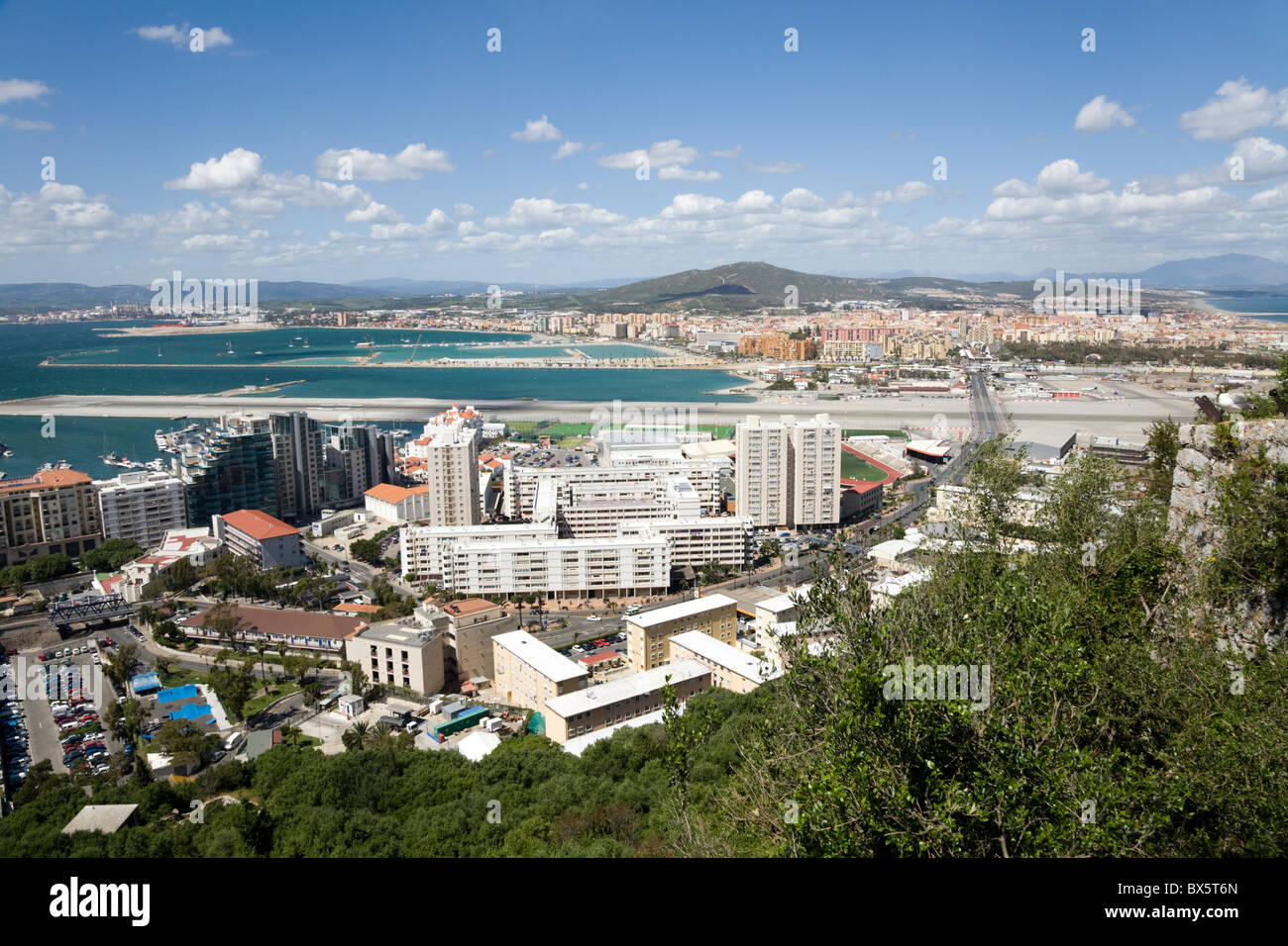 Looking over Gibraltar airport runway, city centre development & building / buildings, towards Spain: from the Rock of Gibraltar Stock Photo