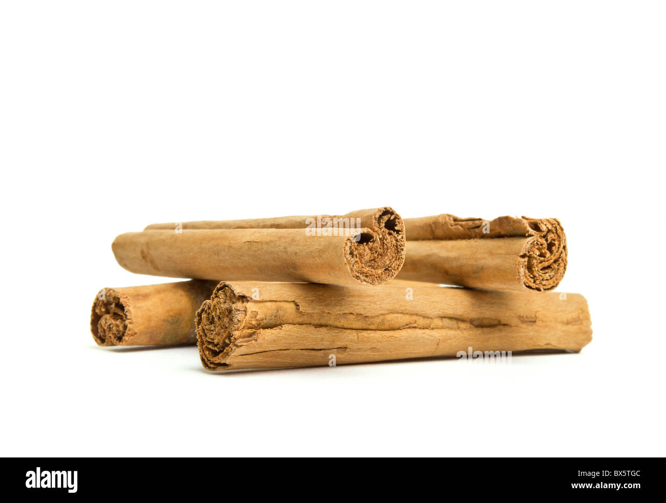 isolated Cinnamon sticks from low perspective isolated on white. Stock Photo