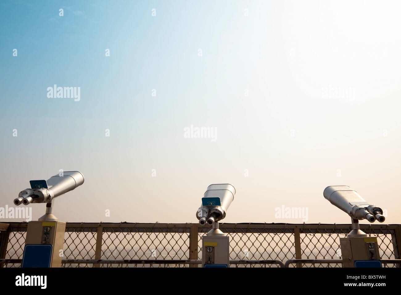 Three Telescope on the roof and looking to the sky Stock Photo