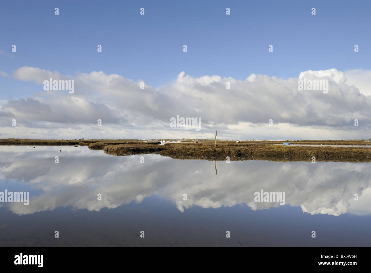 Clouds refected in tidal creek, Brancaster, Norfolk, UK, November Stock ...
