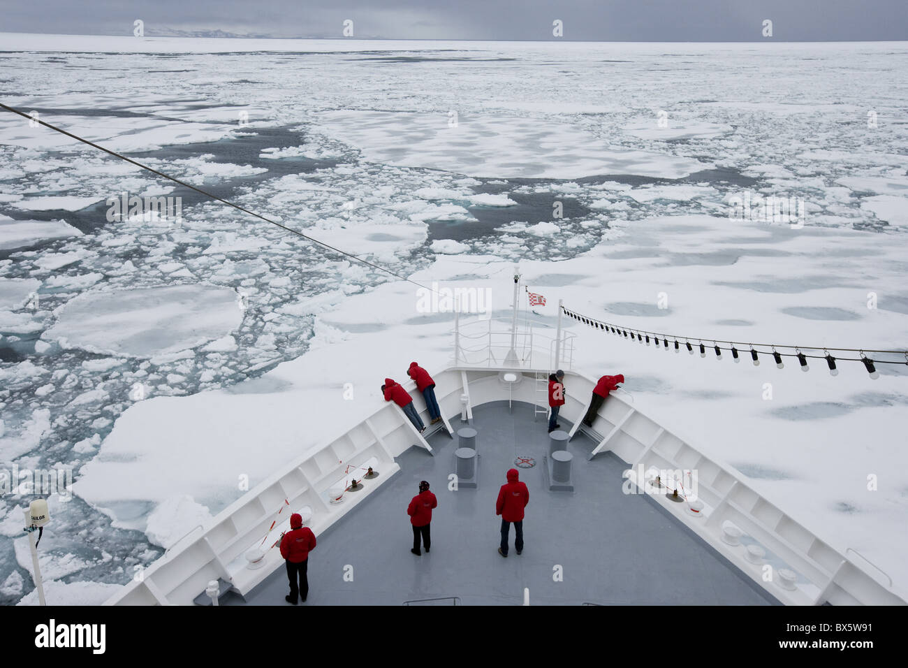 Ship breaking through ice floe and drift ice, Greenland, Arctic, Polar Regions Stock Photo