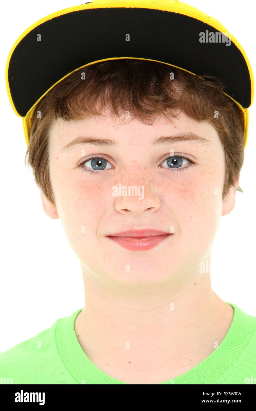 Close up ten year old american boy in yellow cap and green shirt over