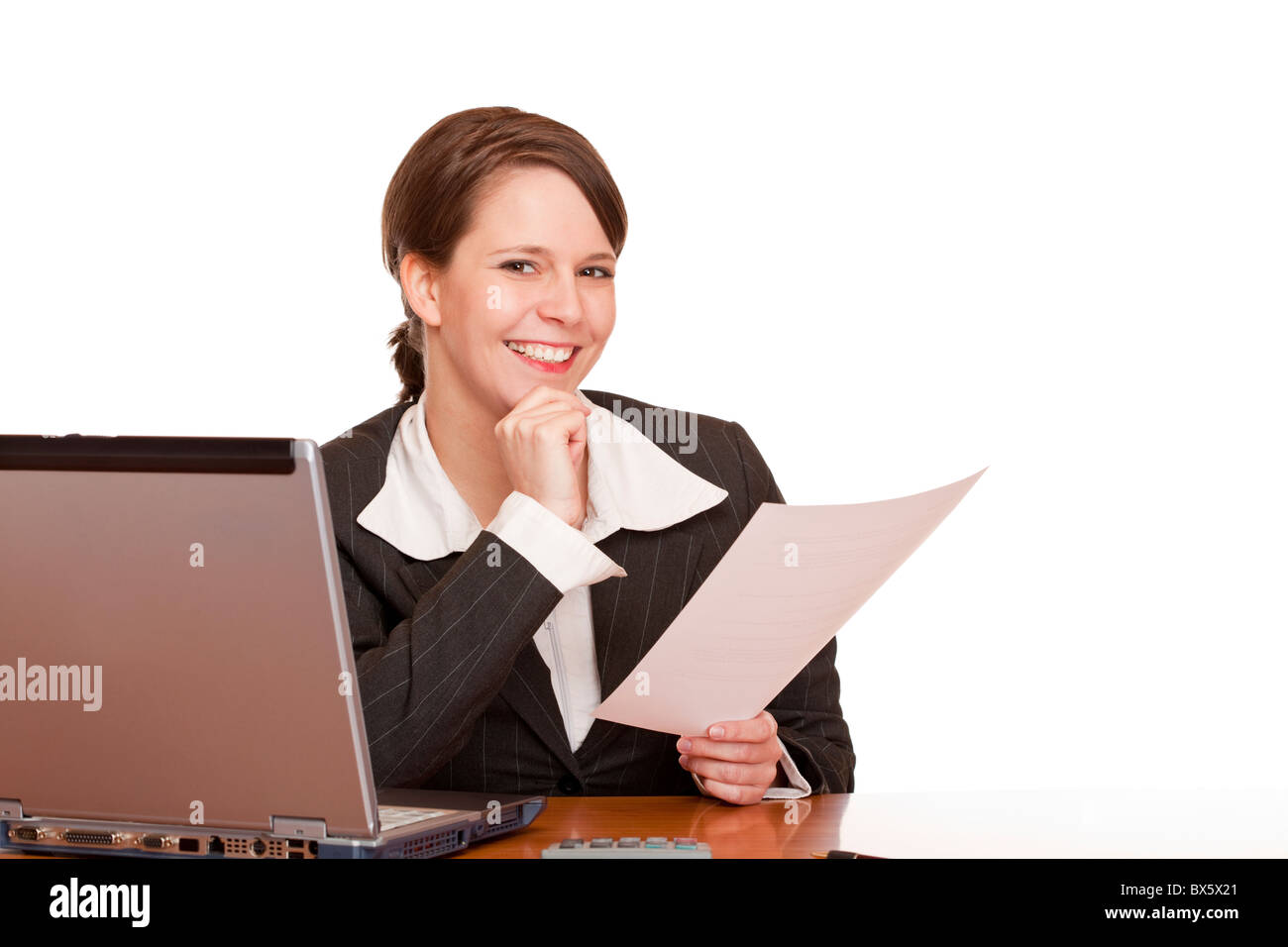 Happy  business woman in office holding a contract. Isolated on white background. Stock Photo