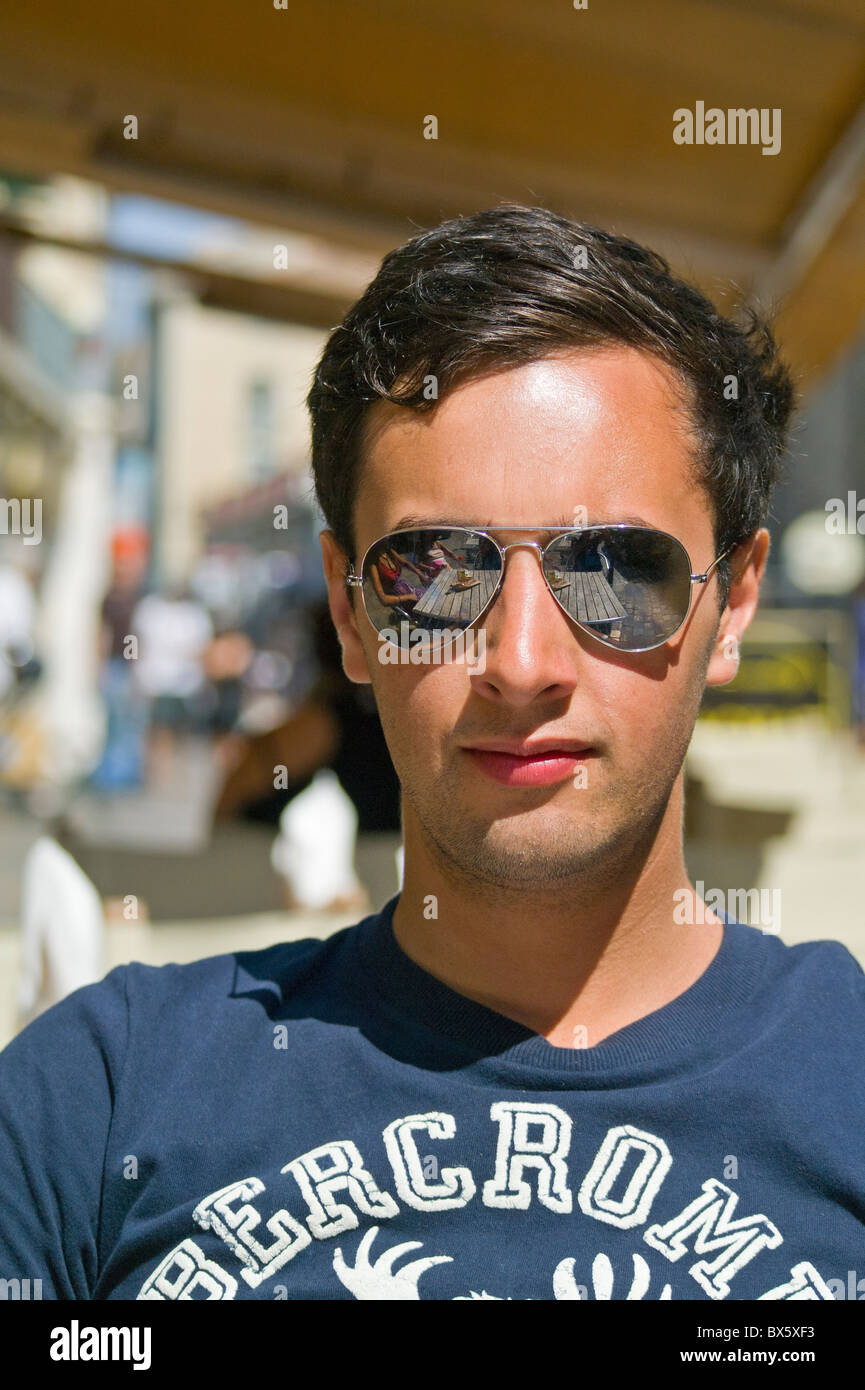 Young Man Wearing Ray Ban Sunglasses Sitting in Sun Stock Photo - Alamy