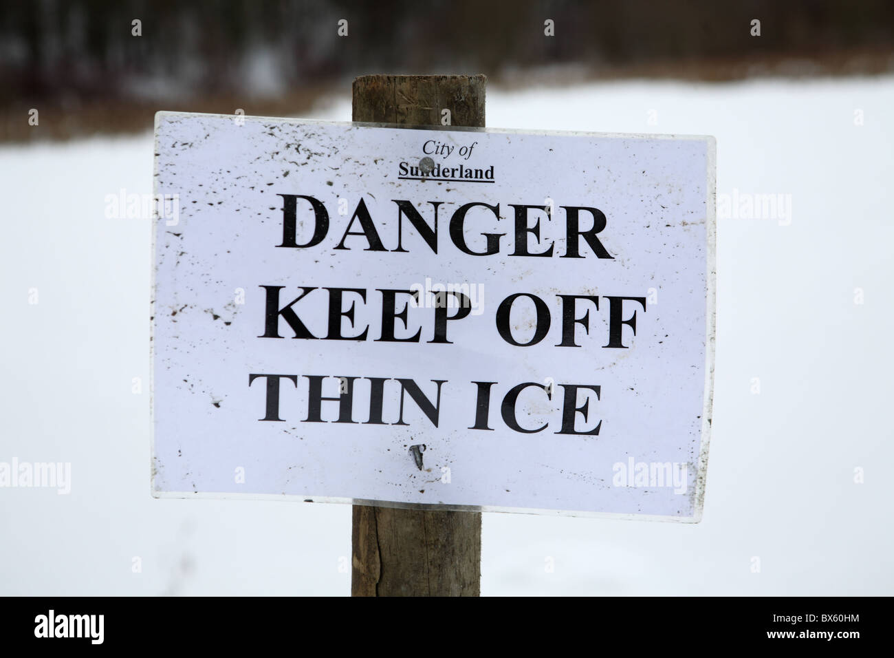 A sign saying Danger Keep Off Thin Ice, James Steel park, Washington, England, UK Stock Photo